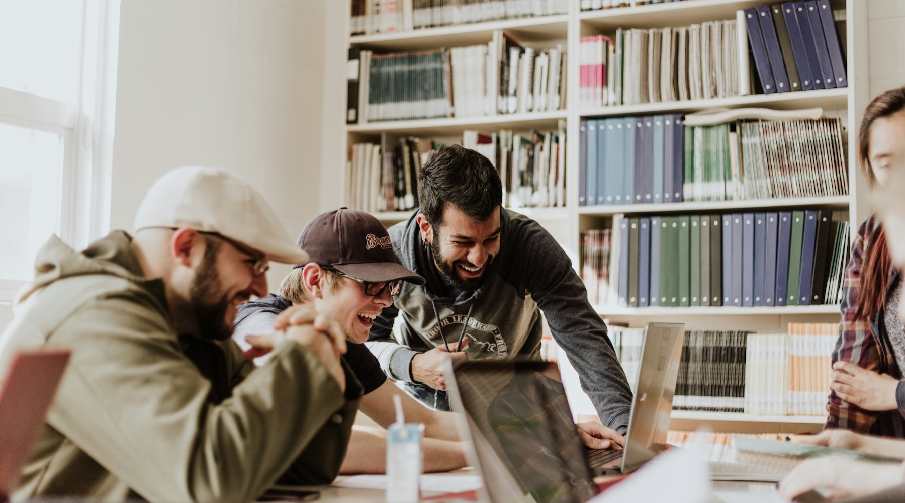 a group of people in a library working together